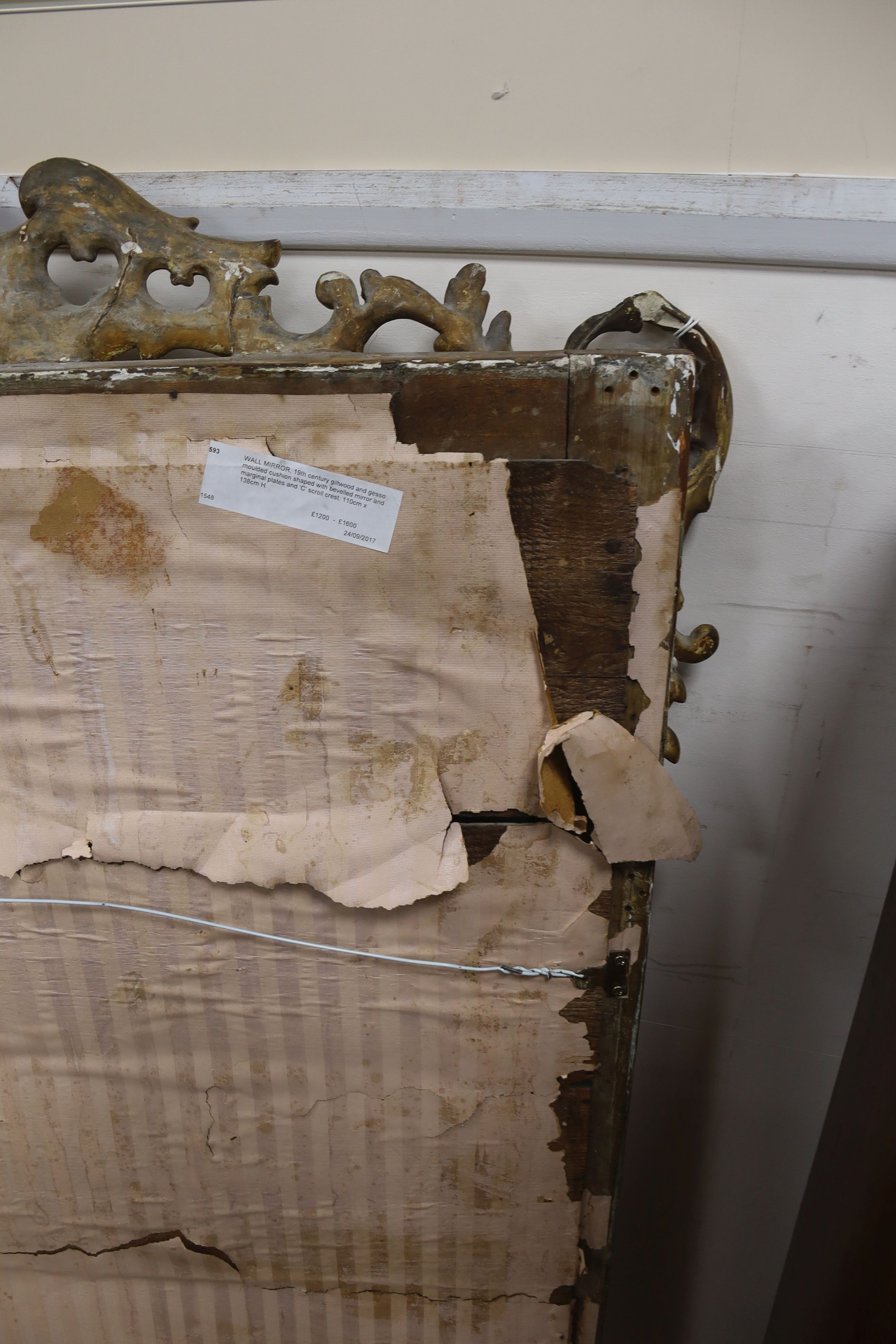A large 19th century French gilt and gesso frame, bevel edged mirror with cushion margin, plated and C scroll, width 108cm, height 137cm